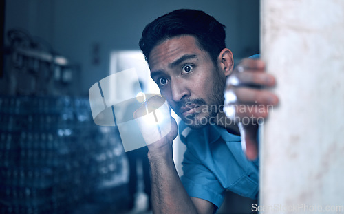 Image of Security, police and man with flashlight for investigation, inspection and property search on night shift. Surveillance, law and male person in dark room for safety, crime and protection service