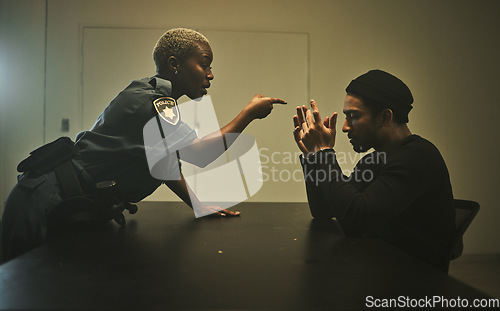 Image of Interrogation, criminal and police pointing in jail for threatening, violence and investigation in station. Arrested, handcuffs and officer with man burglar for stealing, crime and theft in prison