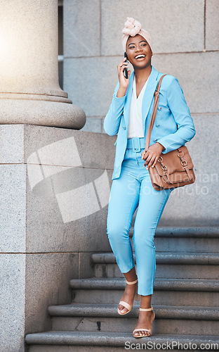 Image of Phone call, happy and businesswoman on stairs in the city walking from her office building. Smile, briefcase and professional African female lawyer on mobile conversation with cellphone in urban town