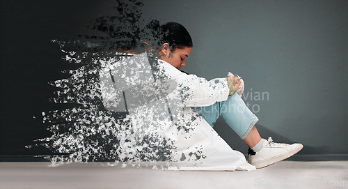 Image of Sad, mental health and woman with depression or thinking of anxiety, problem or frustrated. Fading, depressed and a young person or girl sitting with grief, psychosis or fail on a dark background