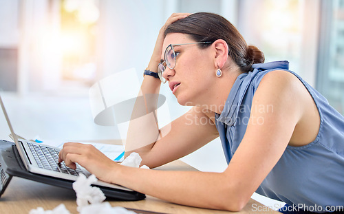 Image of Workplace, stressed and female professional with laptop is tired at office with frustrated. Burnout, job and employee with tech or woman is sick or fatigue or depressed with deadline for online work.