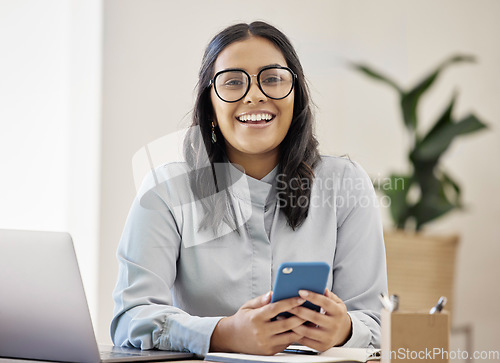 Image of Technology, portrait of happy businesswoman with smartphone and at her desk in a modern office. Online communication or digital connectivity, internet researching and cheerful woman with cellphone