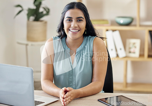 Image of Technology, portrait of a happy businesswoman and laptop at her desk in a modern workplace office. Internet or digital connectivity, administration or research and cheerful female seo manager