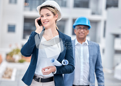 Image of Architect woman, phone call and walking in city, networking and chat with partner, blueprint or negotiation. Architecture team, diversity and smartphone with paperwork, listening and outdoor in metro