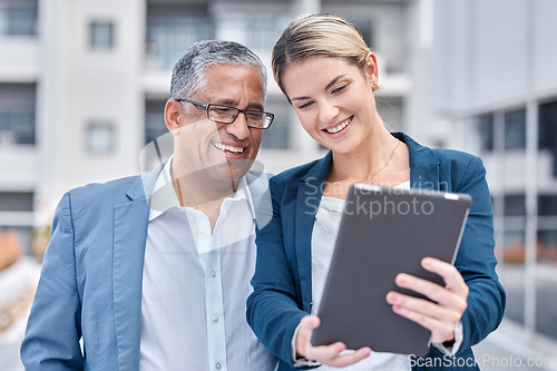 Image of Tablet, collaboration and a business team working together while doing research for an online project. Technology, planning and a corporate woman with her senior mentor, manager or boss in the city