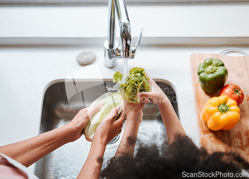 Image of Hands, kid and parent by sink, vegetables or above for cleaning, faucet or water for teaching, cooking or home. Person, child and ready for preparation, start or helping hand with nutrition in family