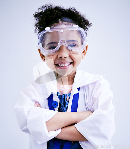 Image of Child, portrait and happy scientist girl in studio with arms crossed, glasses and a smile. Face of a African kid student excited for medical science, education or biology experiment for future career