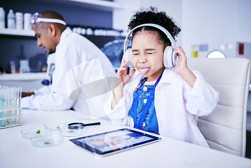 Image of Crazy, lab and child with music and tablet for science with a father or scientist for work or learning. Funny, future and a comic girl streaming audio on tech with a person for innovation in medicine