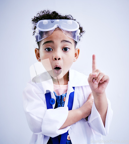 Image of Child, hand and idea or solution for science in studio with mouth open, glasses and thought. Face of a African kid student shocked or wow for scientist, education or biology experiment for innovation