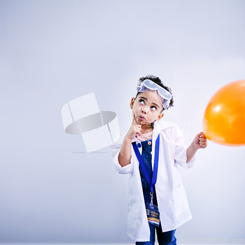 Image of Child, thinking and balloon science in studio with .hand on chin, goggles and idea. African kid student with solution or problem solving, education or fun biology experiment on a white background