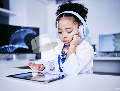 Image of Education, headphones and black girl with elearning on tablet with childhood development. Studying, typing and tech with female child with reading for lessons with online app and software with kid.