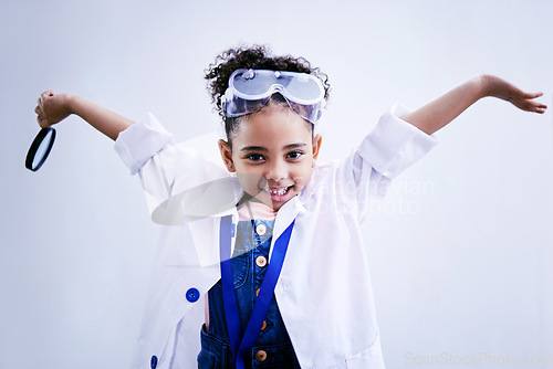 Image of Child, happy and portrait of a scientist girl in studio with open hands, glasses and a magnifier. Face of a African kid student excited for medical science, education or biology experiment for future