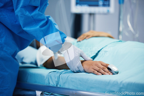 Image of Sick, hand and a doctor with a patient in surgery for pulse, holding hands or support in bed. Hospital, medicine and closeup of a surgeon in theater with a person for consultation or medical nursing