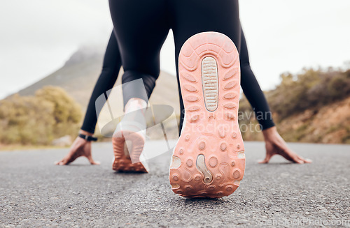 Image of Feet, person and running fitness for workout, training and exercise with sport and active in nature. Athlete sprint and road by a mountain outdoor ready to start a run for health and wellness.