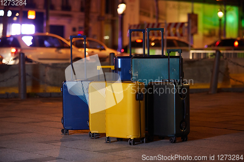 Image of Luggage consisting of six polycarbonate suitcases standing on the street