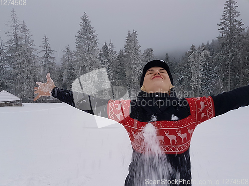 Image of Happy winter time. Well dressed enjoying the winter