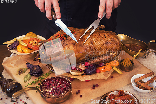 Image of Roasted goose with herbs berries and vegetables