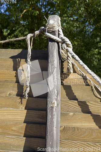 Image of wooden building and rope