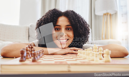 Image of Chess, game and portrait of woman with board for strategy, thinking and challenge at home. Competition, winning and female person with chessboard in living room ready for playing and problem solving