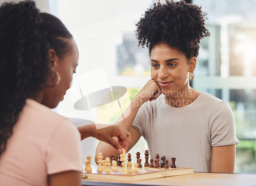 Image of Chess, game and women with board for thinking strategy and challenge friends in living room. Competition, planning and female people with chessboard playing for winning, checkmate and problem solving