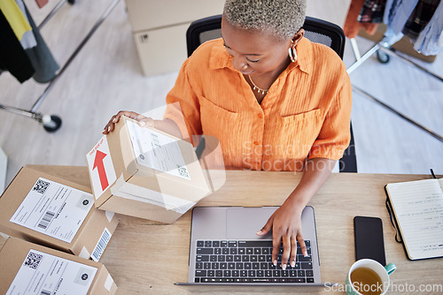 Image of Laptop, logistics or black woman with box for shipping, delivery or package in ecommerce online. Typing, above or business owner with product label or store order for cargo service or sticker sign