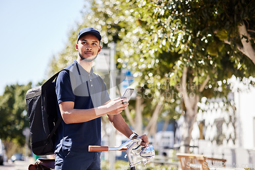 Image of Bicycle, phone and delivery service by man use maps on smartphone to navigate city for package, product or fast food. Bike, mobile app and courier employee use internet for direction or ecommerce web