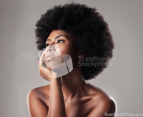 Image of Skin, face and natural beauty, black woman thinking, cosmetics and glow isolated on studio background. Skincare, dermatology and facial treatment, African model with makeup and ideas with shine