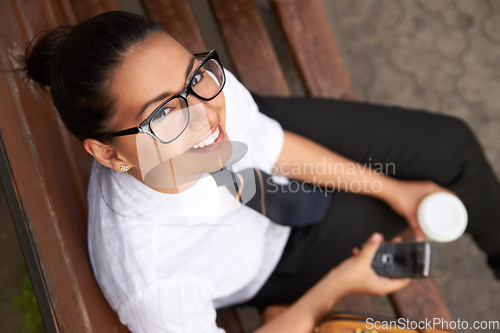 Image of School, portrait from above and student with a phone after class, education or rest from studying and learning. Girl, smile on face and reading or drinking tea on coffee break formal uniform