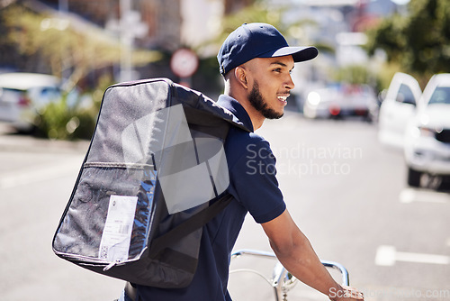 Image of Man, bicycle and delivery in city with bag of logistics, distribution service and fast food order. Courier, eco friendly transport or deliveryman travel on bike with ecommerce product in urban street