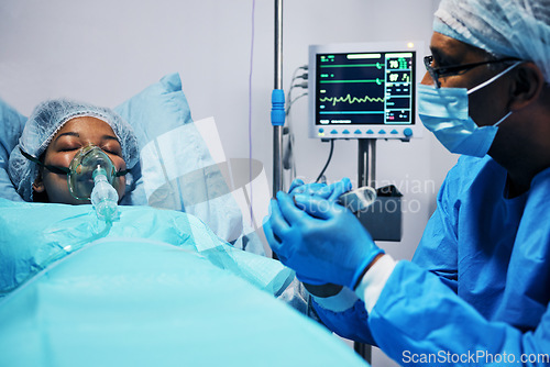 Image of Healthcare, doctor and patient holding hands in hope after surgery, emergency care and hospital bed. Breathing, monitor and air, surgeon with helping hand in operation, support for medical results.