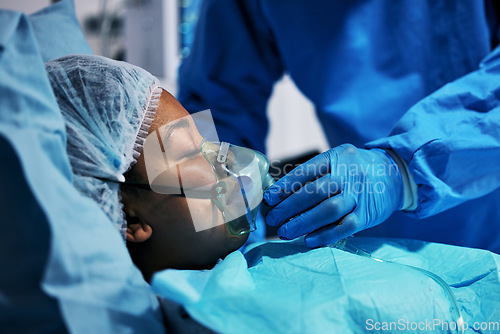 Image of Healthcare, doctor and patient in oxygen mask for surgery, emergency care and hospital bed. Breathing, support and air, surgeon helping person in operation, professional service for medical results.