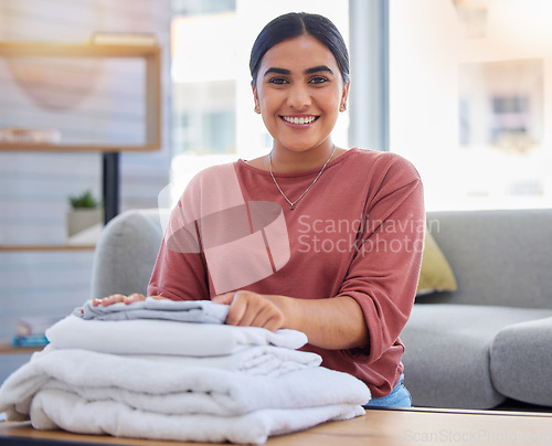 Image of Cleaning, happy and laundry with portrait of woman in living room for housekeeping service, clothes and fabric. Hospitality, smile and cleaner with person at home for maintenance and washing