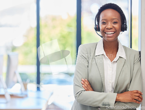 Image of Happy black woman, call center and portrait with arms crossed for customer service, telecom and consultant in CRM office. Female agent smile for sales consulting, telemarketing and pride for support