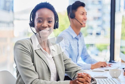 Image of Black woman, telemarketing and smile at help desk for communication, customer support or contact in coworking call center for CRM. Happy female agent consulting for sales, telecom or advice in office