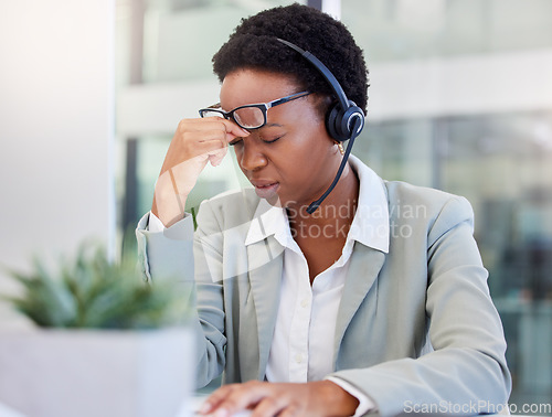 Image of Call center, headache and black woman frustrated by faq, customer service or internet delay in office. Stress, migraine and African lady consultant with vertigo, glitch or problem while consulting