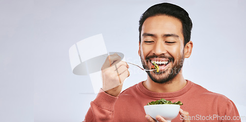 Image of Fruit, healthy food and happy asian man in studio for health, wellness or detox on grey background. Breakfast, salad and face of guy nutritionist smile for clean, green or raw diet or vegan lifestyle