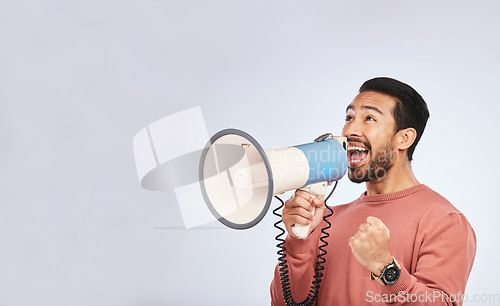 Image of Megaphone, man and shout in studio space, white background and broadcast speech, announcement and mockup. Asian model, microphone and advertising sales, news and attention of deal, promotion or offer