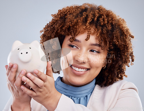 Image of Woman with smile, piggy bank and savings in studio, finance and budget in hands with investment loan. Happiness, growth and profit inflation, salary management girl with money box on white background