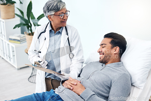 Image of Man, doctor and insurance report with talk and senior professional at a hospital for health. Wellness, consultation and patient at a medical clinic for expert advice and woman with healthcare