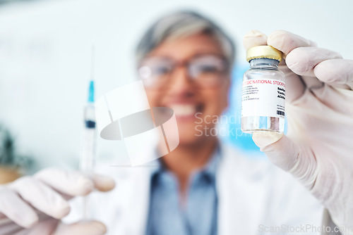 Image of Hands, vaccine and woman doctor in hospital with medical, innovation or cure for smallpox in closeup. Vaccination, vial and health expert with syringe for healthcare, injection or covid treatment