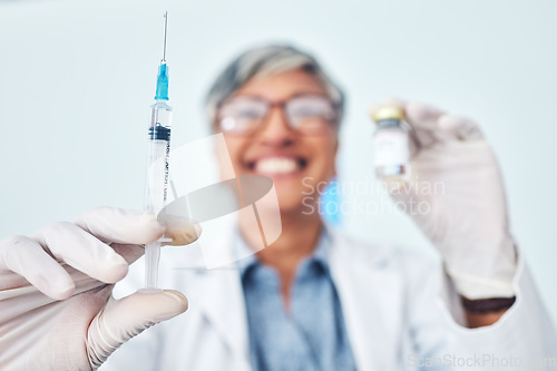 Image of Vaccine, hands and woman doctor in hospital with medical, innovation or cure on blurred background. Vaccination, vial and lady health expert with syringe for healthcare, injection or covid treatment