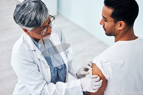 Image of Doctor, arm and man with plaster for vaccine, healthcare protection and safety from virus in clinic. Consultation, patient and woman medical professional in hospital for vaccination or medicine cover