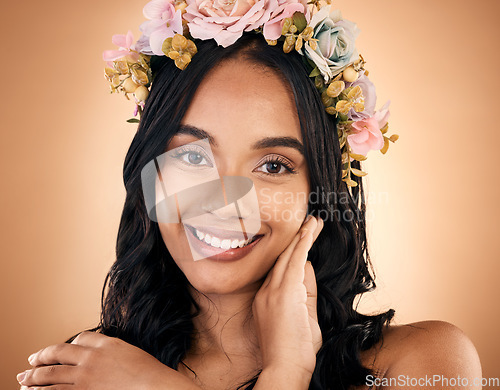 Image of Portrait, skincare and flower crown with a model woman in studio on a brown background for shampoo treatment. Face, smile or beauty with a happy young person looking confident about natural cosmetics