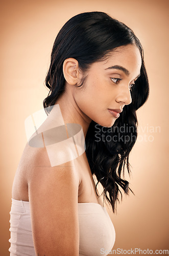 Image of Thinking, texture and woman with hair care, salon treatment and self care against a brown studio background. Female person, girl and model with ideas, aesthetic and skincare with beauty and luxury