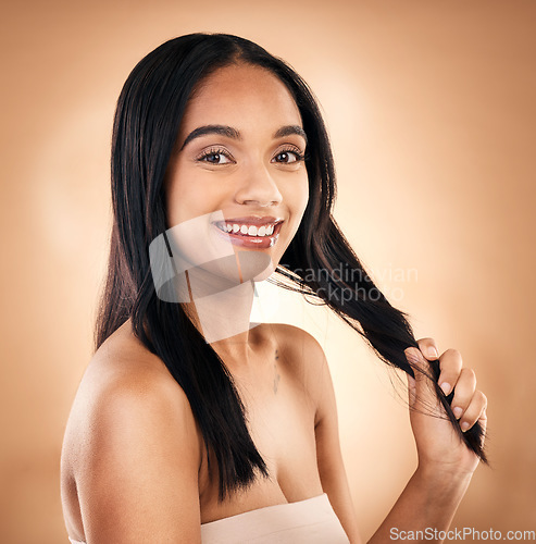 Image of Portrait, hair and shampoo with a model woman in studio on a brown background for keratin treatment. Face, salon and smile with a happy young person looking confident about haircare cosmetics