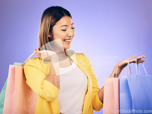 Image of Happy, face and woman with shopping bag from a sale, promotion or customer with deal on retail clothing. Asian model, shop for fashion and discount at market, mall or commercial store mockup