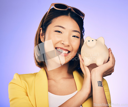 Image of Piggy bank, finance portrait and woman with savings, investment and happy for budget insurance. Young asian person for financial management, money safe or banking security on studio purple background