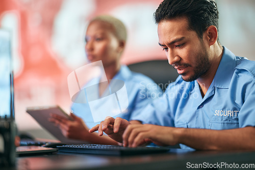 Image of Man, police and typing on keyboard for communication, alert or surveillance of mall cop at desk. Male person or security guard on computer for monitoring, CCTV or emergency dispatch in crime safety