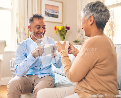 Image of Coffee, smile and a senior couple on a sofa in the home living room to relax while bonding in conversation. Love, retirement or marriage with a mature man and woman talking while drinking a beverage