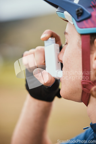 Image of Asthma, inhaler and cyclist with medical and breathing medicine for fitness and training. Outdoor, lung support and bicycle athlete with exercise and breathe pump for wellness and sport health